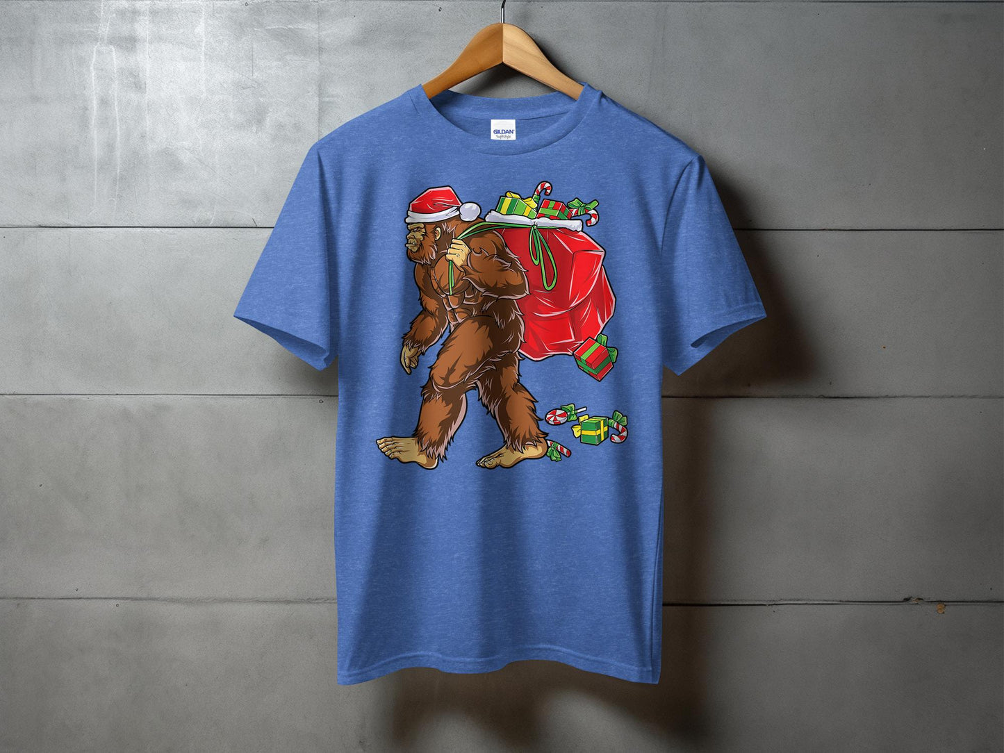 Bigfoot Carrying Presents Santa Hat Funny Christmas T-Shirt