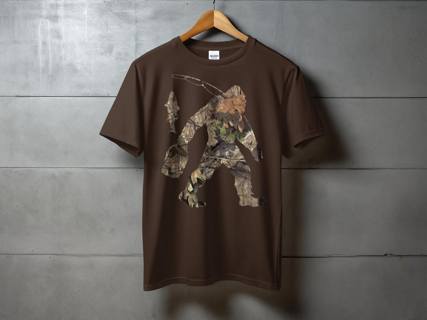 Bigfoot Carrying Fish Hidden in Forest Camouflage T-Shirt