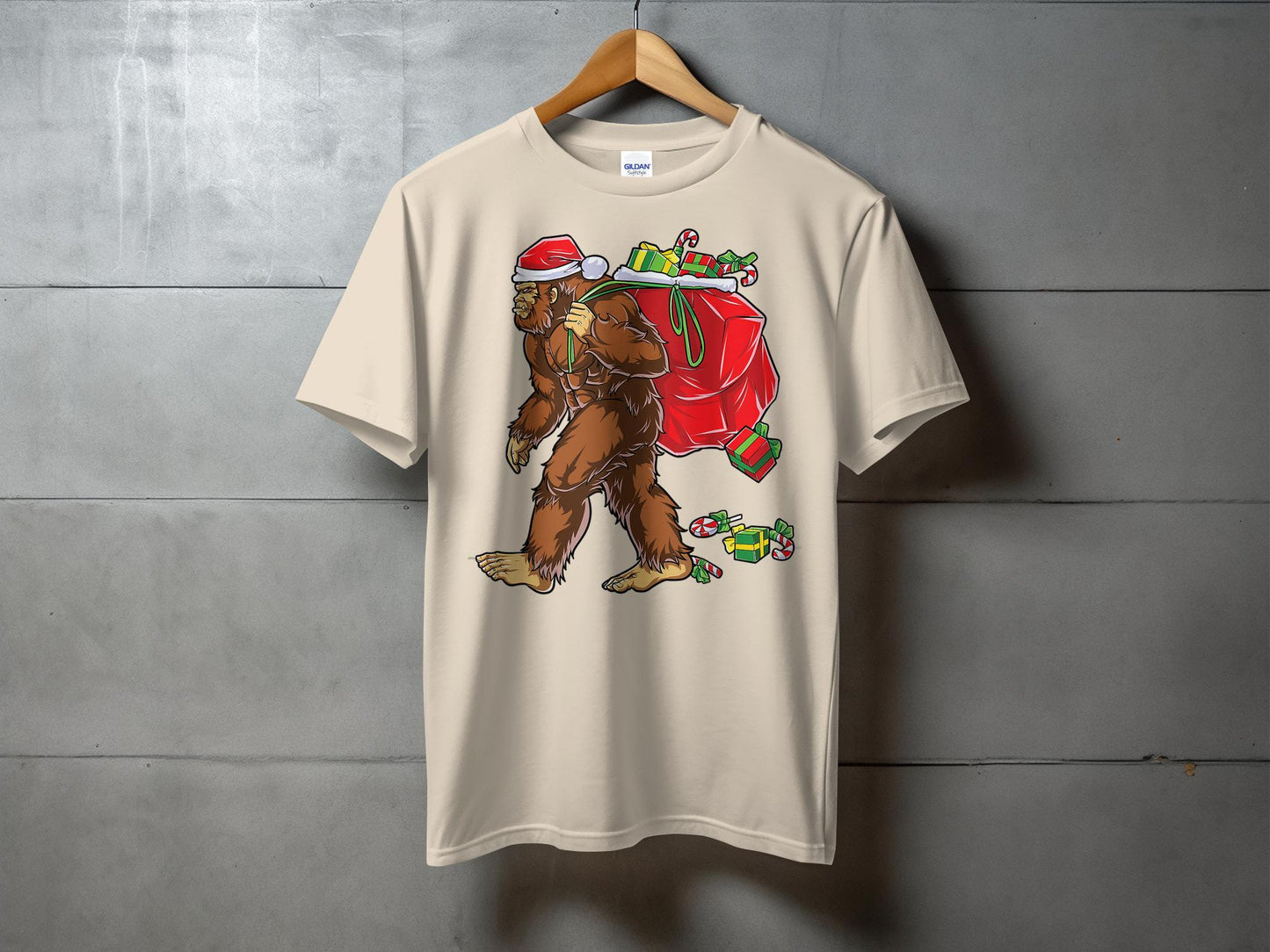 Bigfoot Carrying Presents Santa Hat Funny Christmas T-Shirt