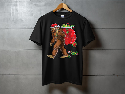 Bigfoot Carrying Presents Santa Hat Funny Christmas T-Shirt